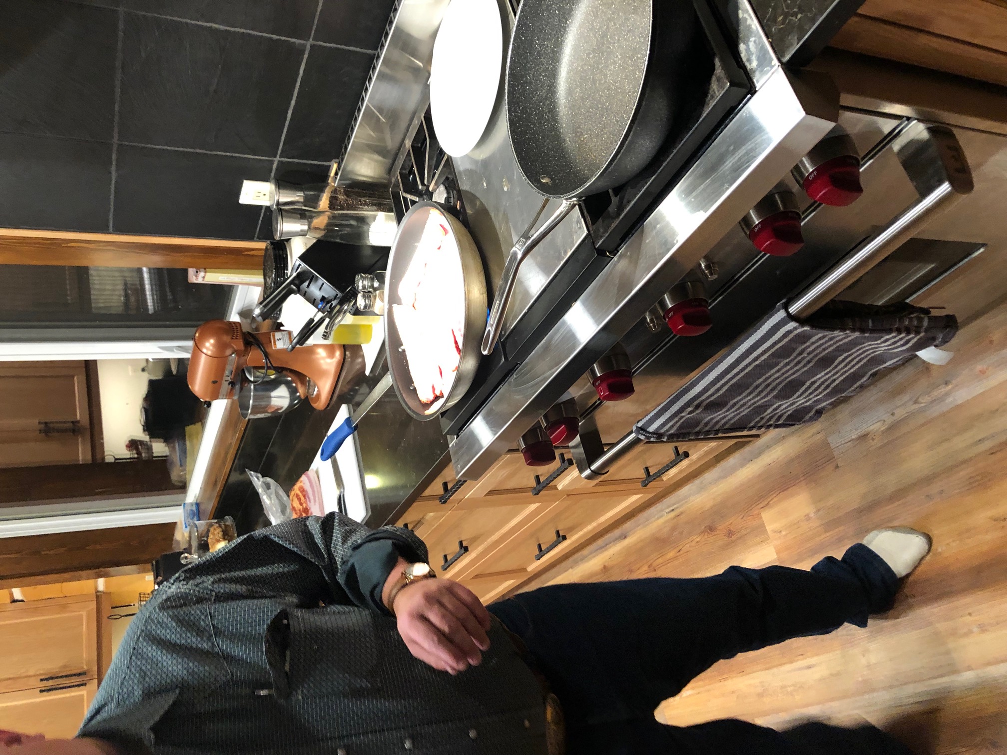 Frank cooking breakfast in main lodge kitchen.jpg