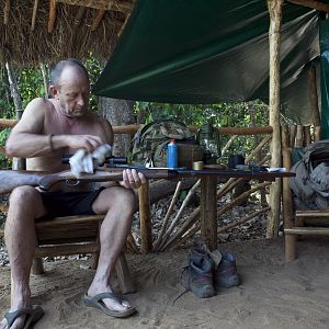 Cameron cleaning rifle...