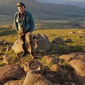 Admiring his Vaal Rhebok after hiking to the animal , Kwa Zulu Natal