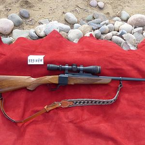 375 H&H Dakota Model 10 Rifle with Express sights, Leupold VX2 3x9x40 in Talley rings