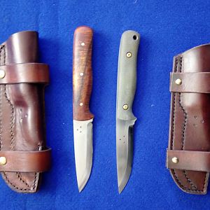 A Koa & Micarta Bushcraft Hunter Knives in the horizontal Cross Draw Sheath