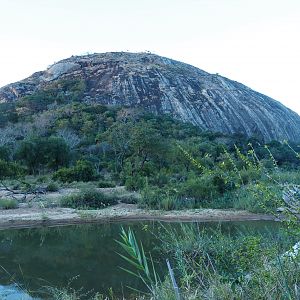 Gigantic rock and the river’s edge