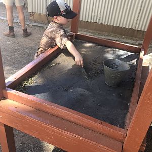 Jeremy busy with bucket of mine tailings