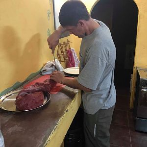 Charles cutting up some steaks