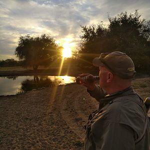 Sundowners at waterhole in South Africa