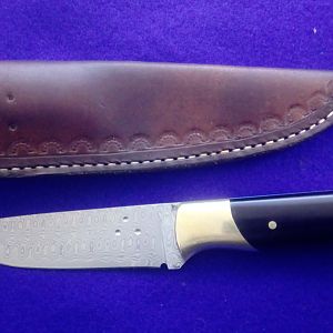 Knife with Raindrop stainless damascus blade and Buffalo horn