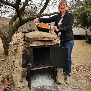 Baking fresh bread in a wood fired oven