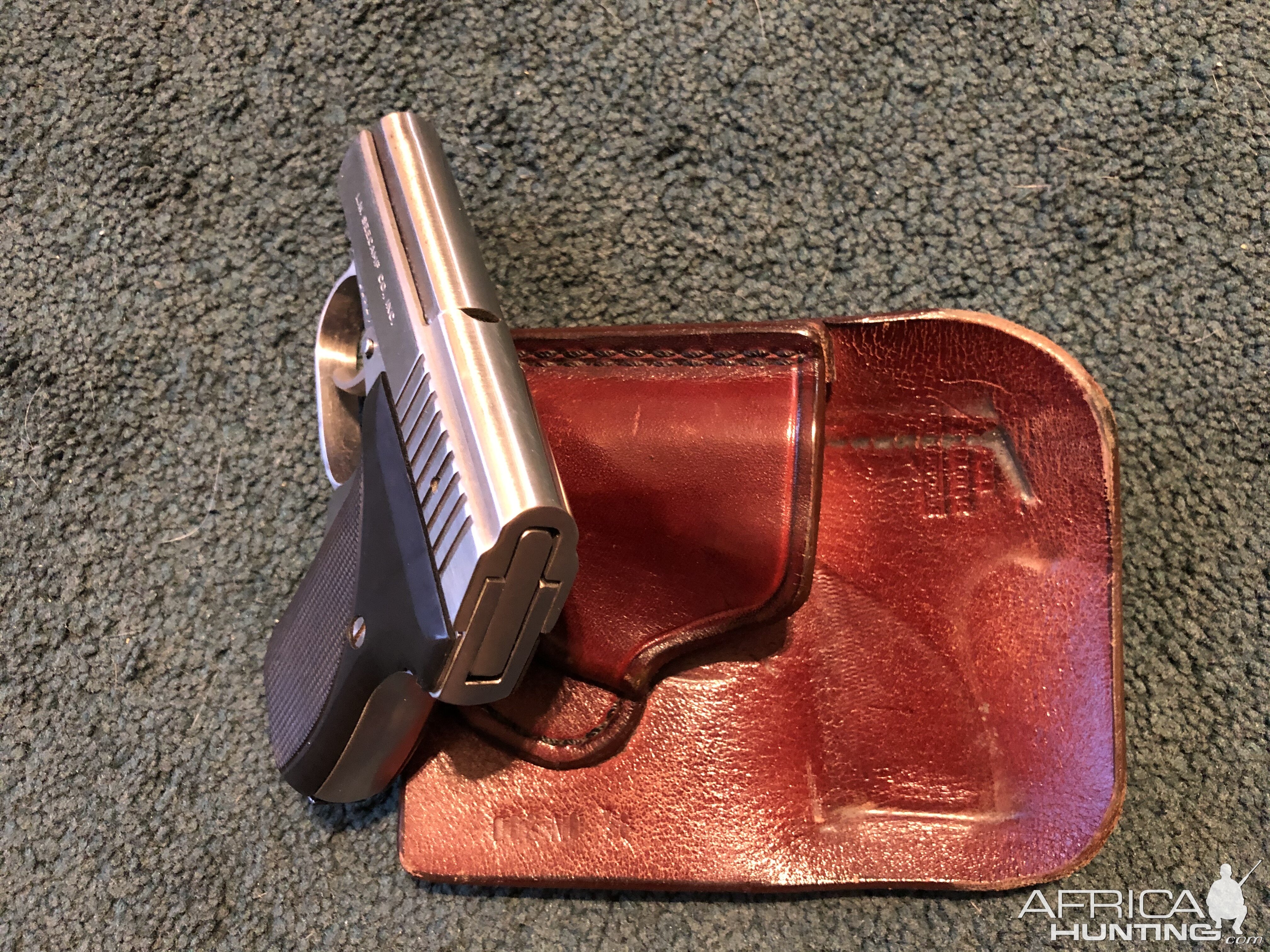 .32 Seecamp semi-automatic Pistol and its wallet holster