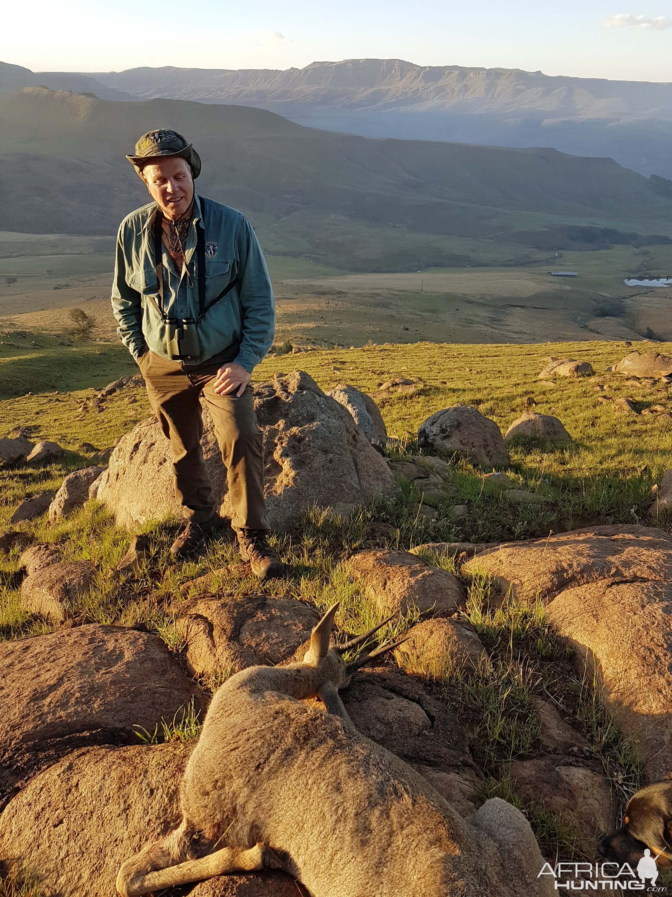 Admiring his Vaal Rhebok after hiking to the animal , Kwa Zulu Natal