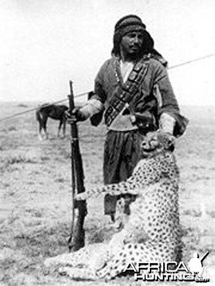 Bedouin hunter with a shot Asiatic Cheetah and cub, Iraq, 1925