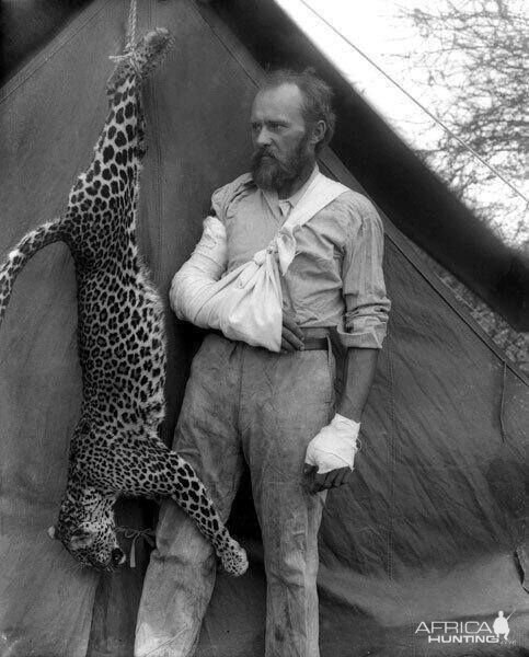 Biologist and the animal activist Karl Eykli poses with a leopard whom he killed naked 1896 Africa