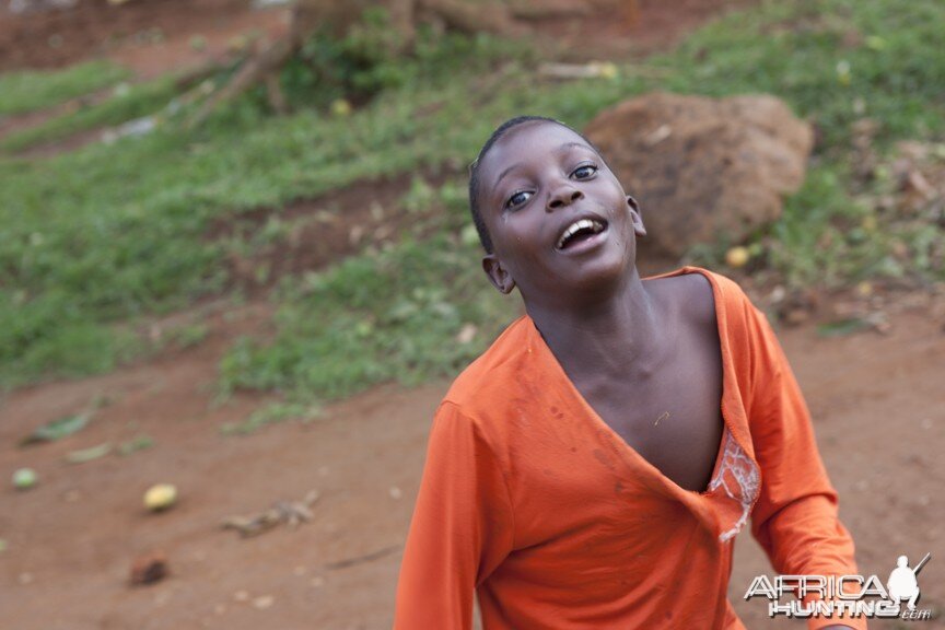 Bugala happy kid in orange, Uganda