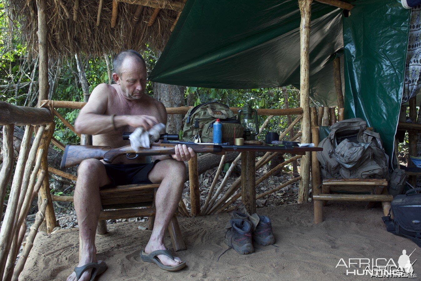 Cameron cleaning rifle...