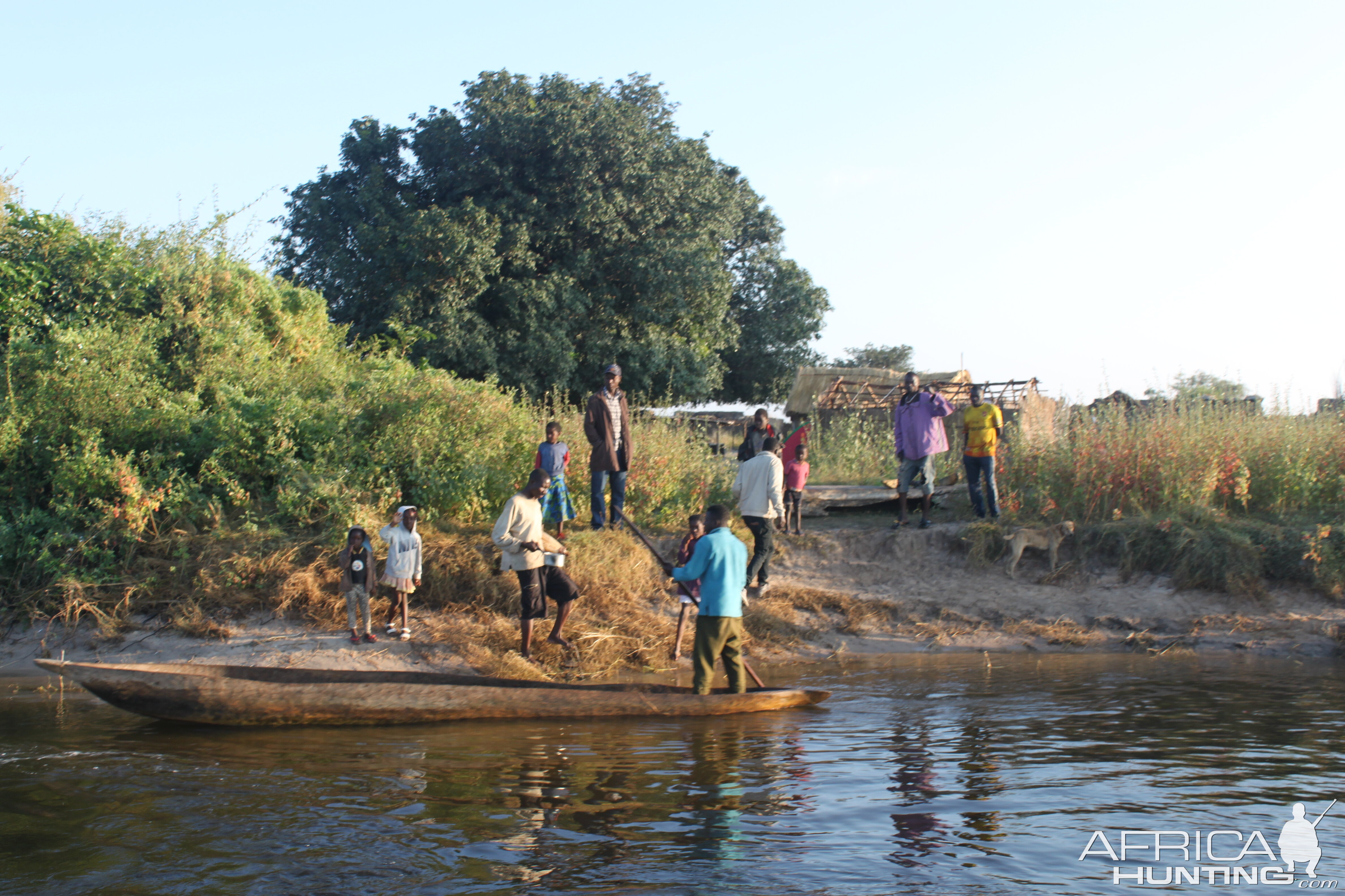 Dugout canoes & netters selling bait