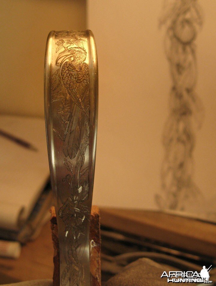 Engraved long trigger guard