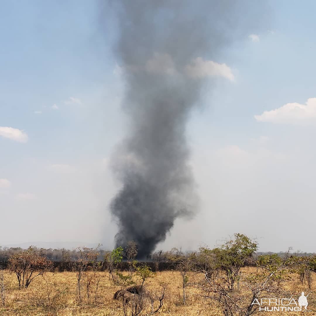 Fire burning through the long grass way to the North