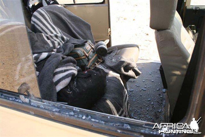 Lion Attack - Vehicle's broken out window from the Lion's charge