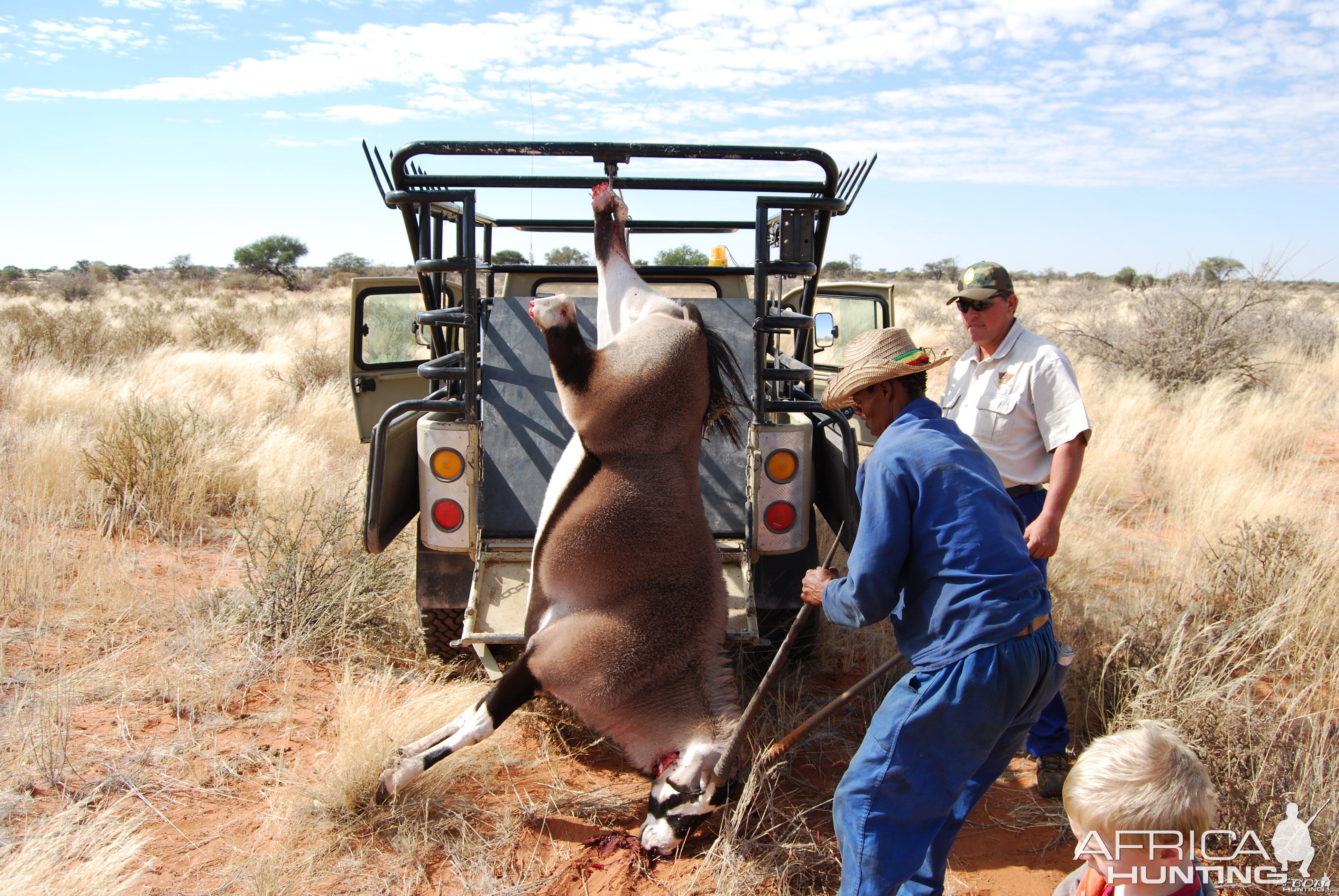 My son, Solomon and Me loading an Oryx taken for the house