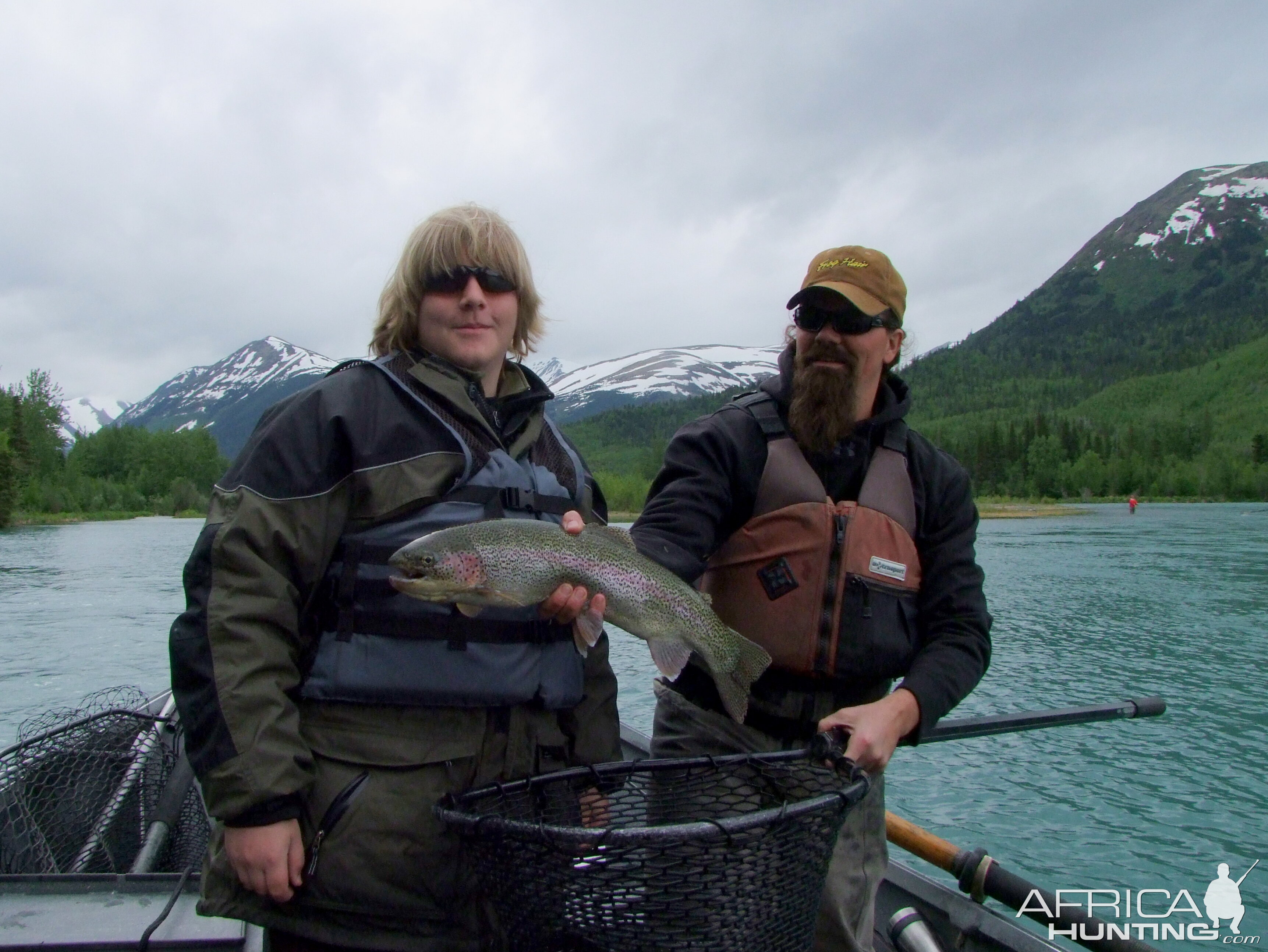 My son with the biggest rainbow of the day on the Kenai River