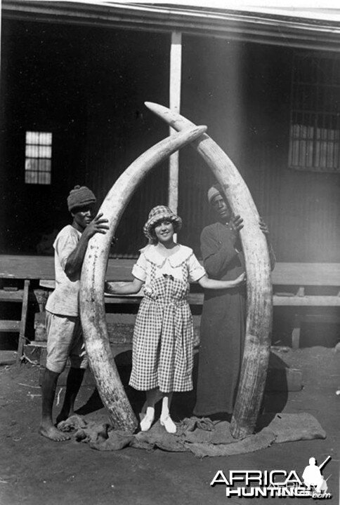 Osa Johnson holding 8 feet Elephant Tusks, circa 1920