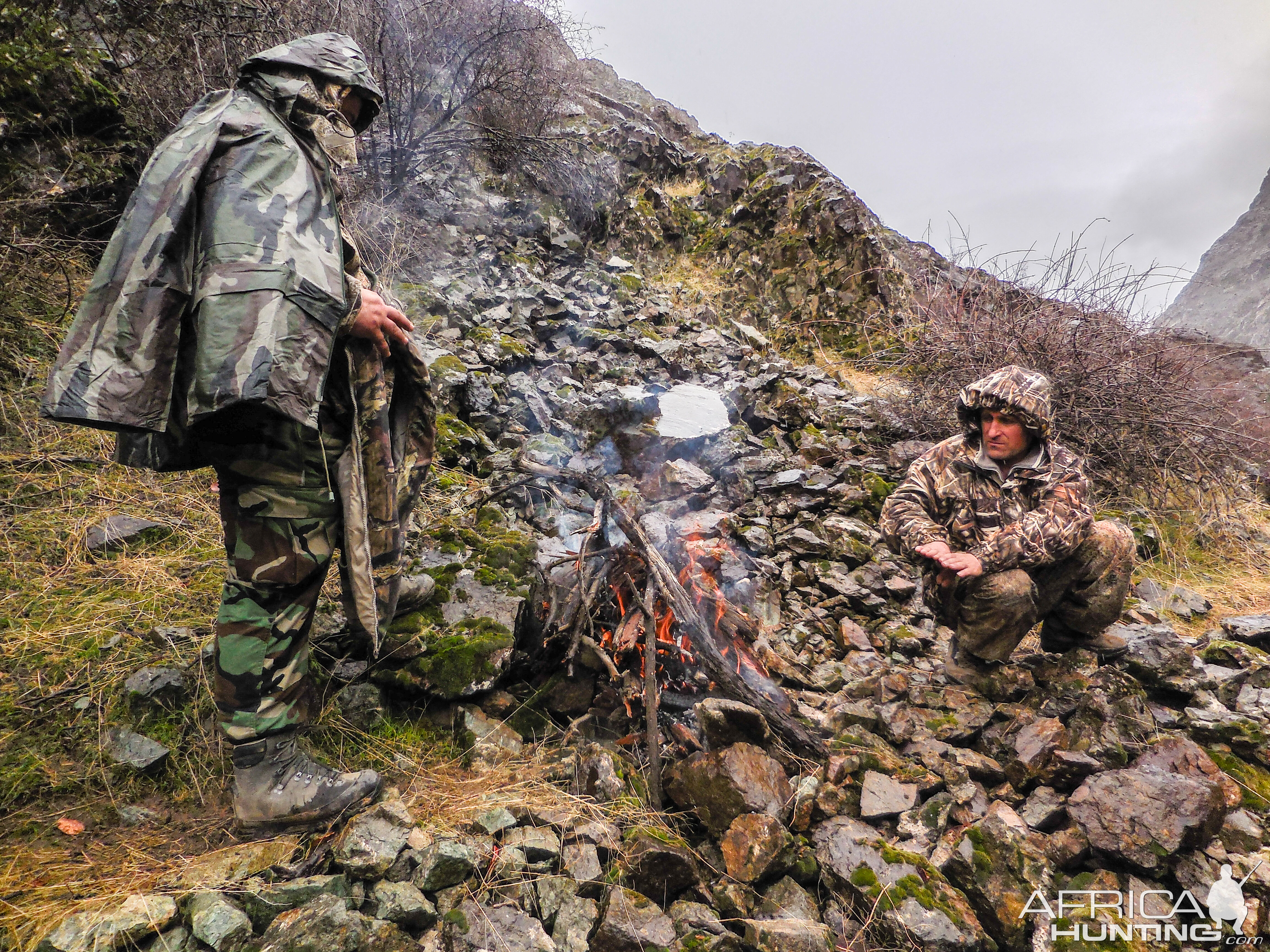 Warming up around fire in Tadjikistan when hunting Ibex